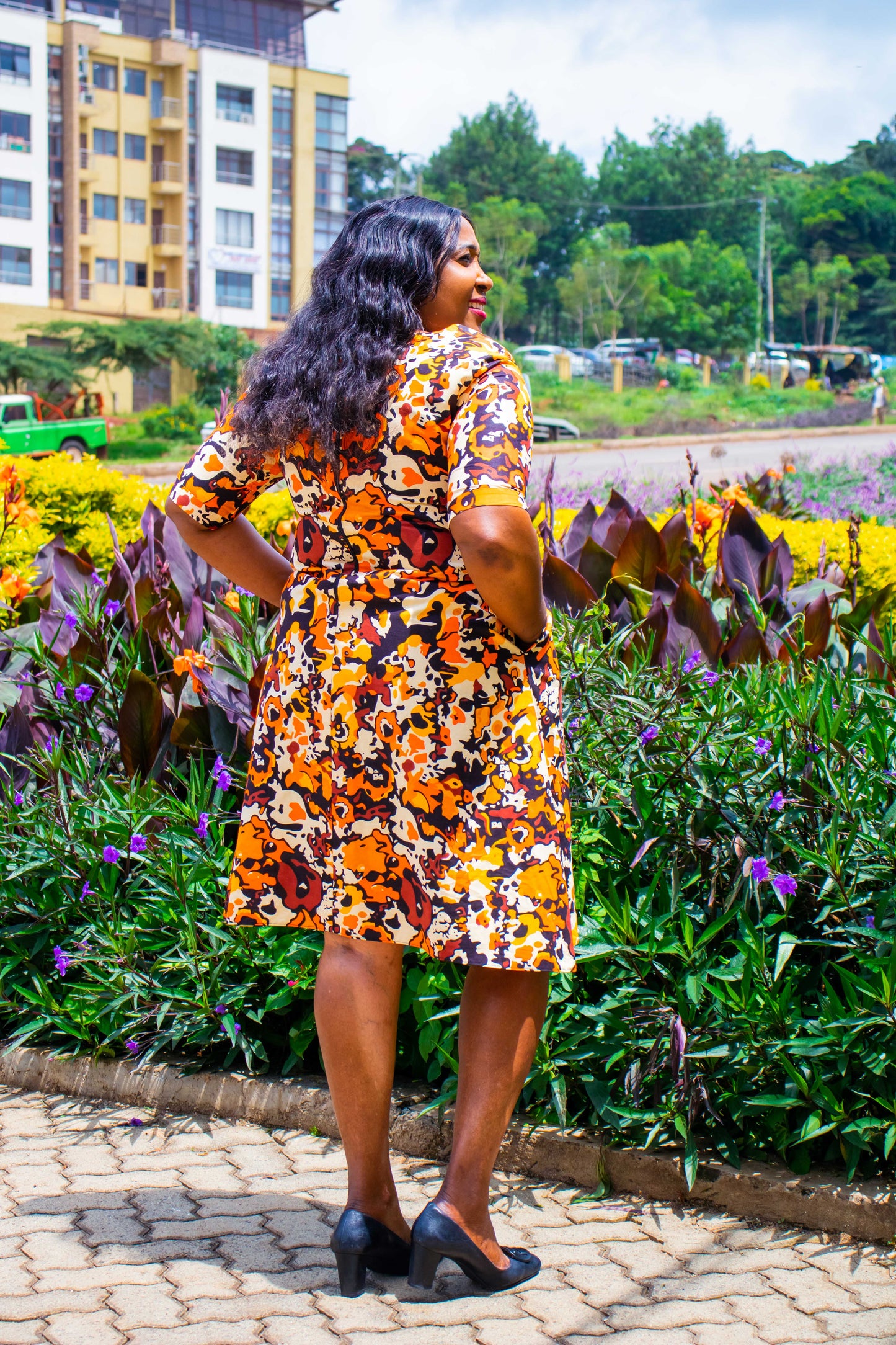 A-Line dress with orange, cream, yellow and brown floral motif