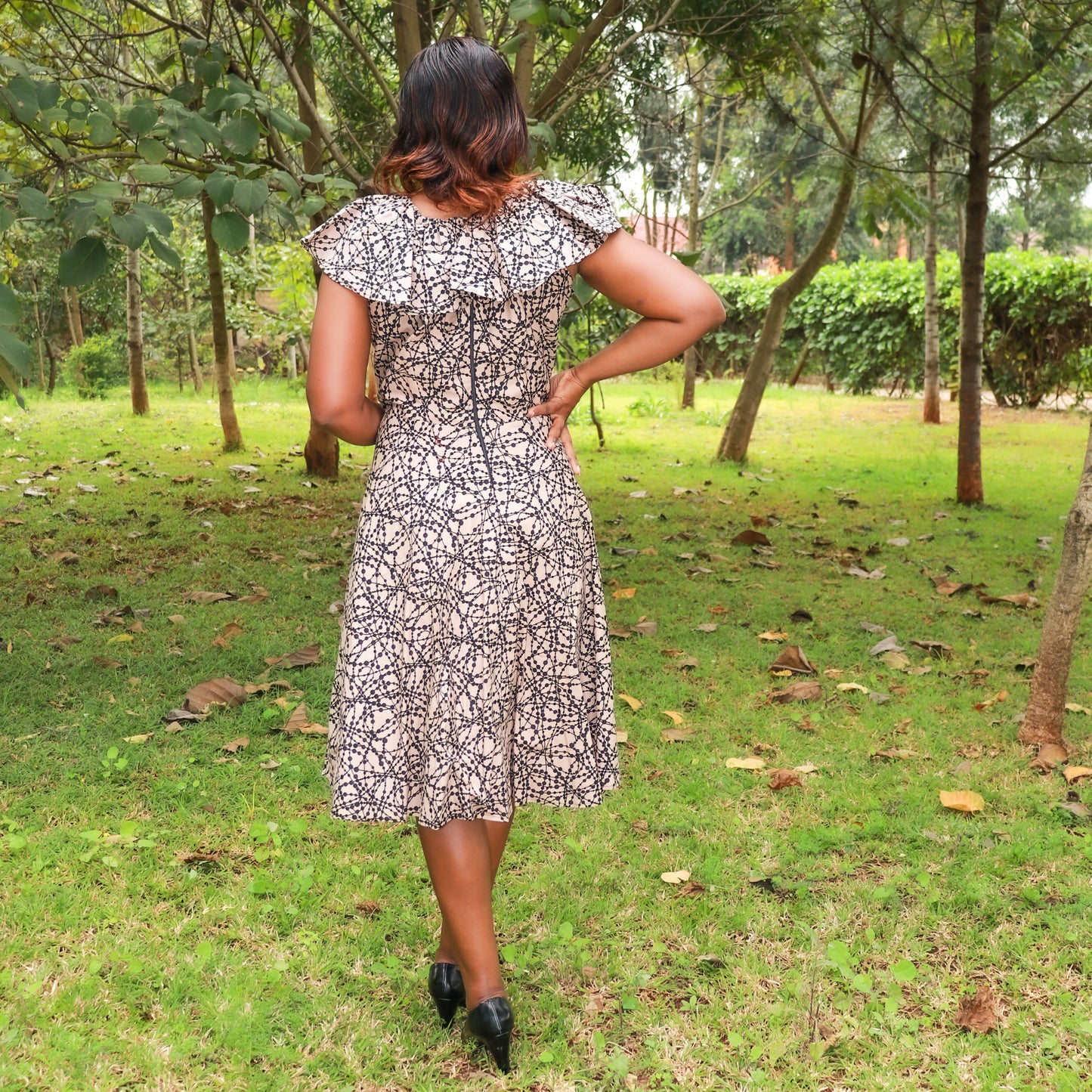 A-Line: Dark cream with black dots motif.