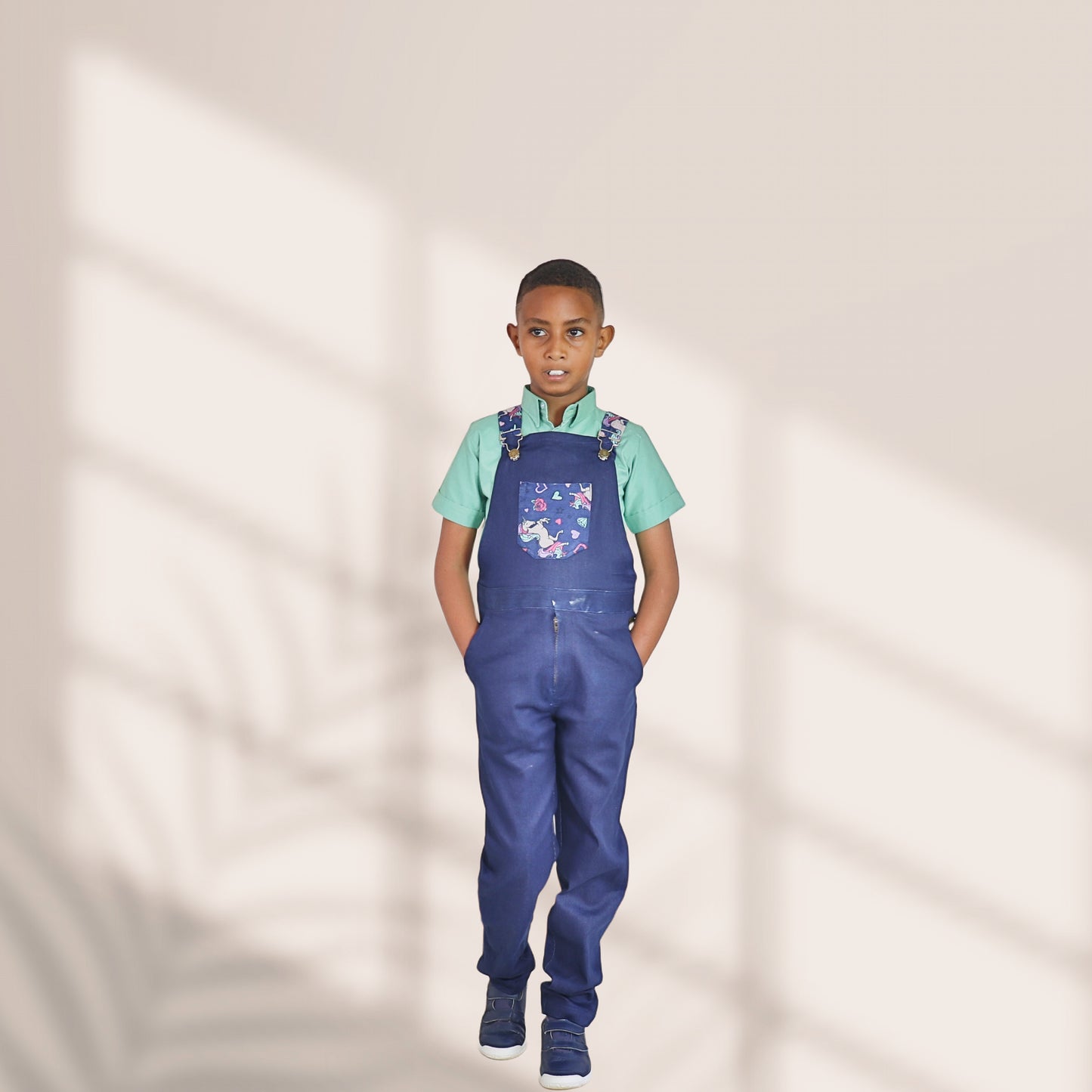 Dungarees-Navy blue jeans material and unicorn prints motif on chest pocket: