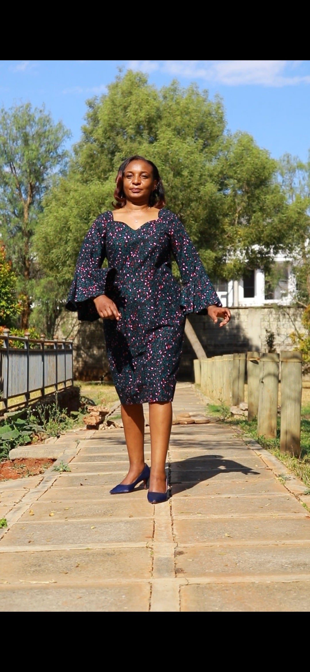 Sheath - Black background with light and dark pink floral motif.