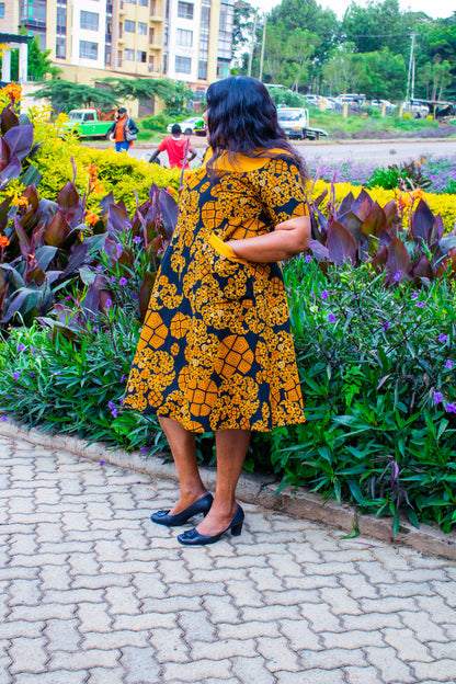 A-Line dress of Gold, black orange and  cream floral motif