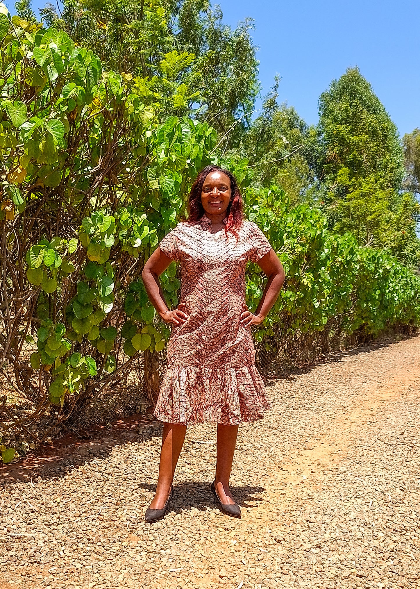 Sheath dress of peach and brown leaf motif