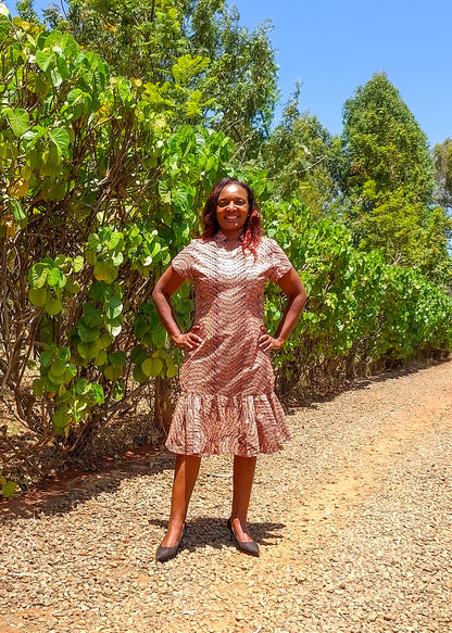 Sheath dress of peach and brown leaf motif