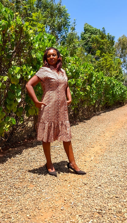 Sheath dress of peach and brown leaf motif