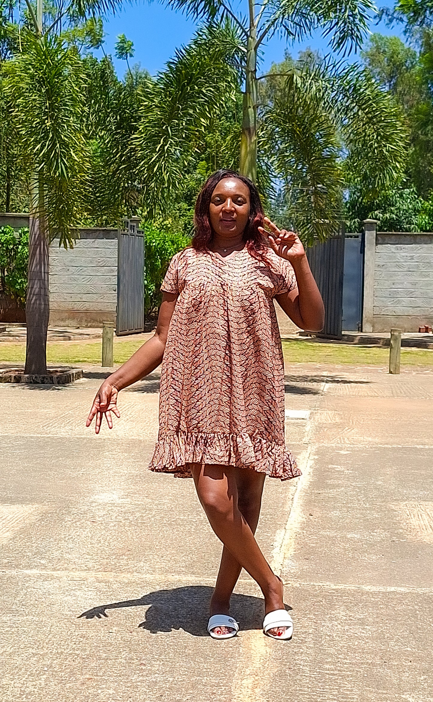 Sheath dress of peach and brown leaf motif