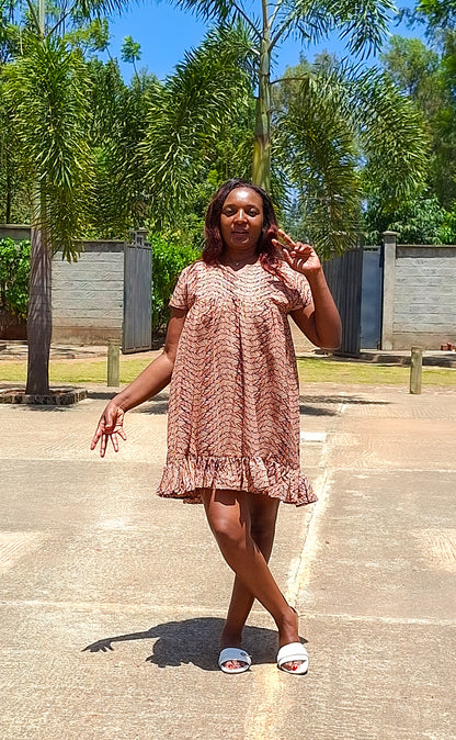 Sheath dress of peach and brown leaf motif