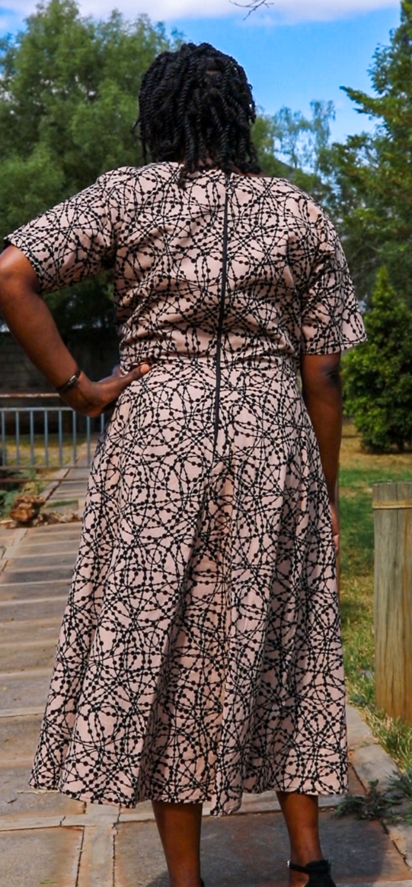 A-Line - ivory  cream  with black loops and  dots motif.