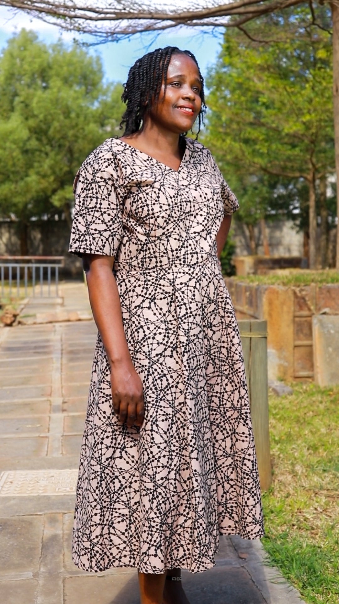 A-Line - ivory  cream  with black loops and  dots motif.