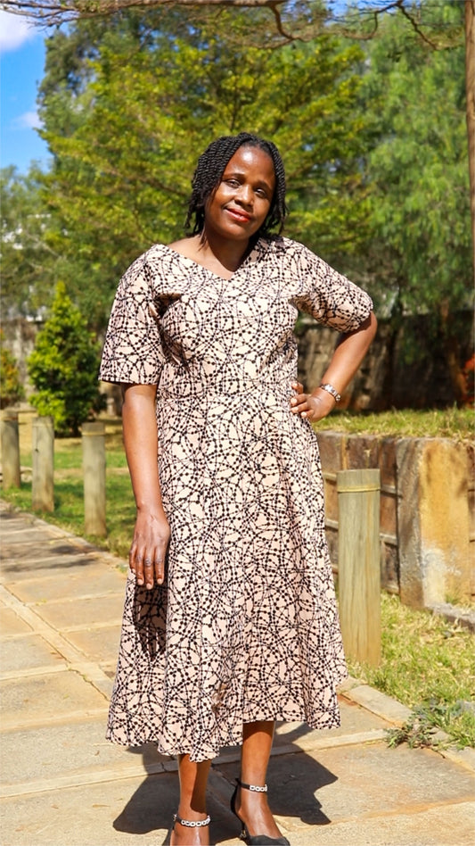 A-Line - ivory  cream  with black loops and  dots motif.