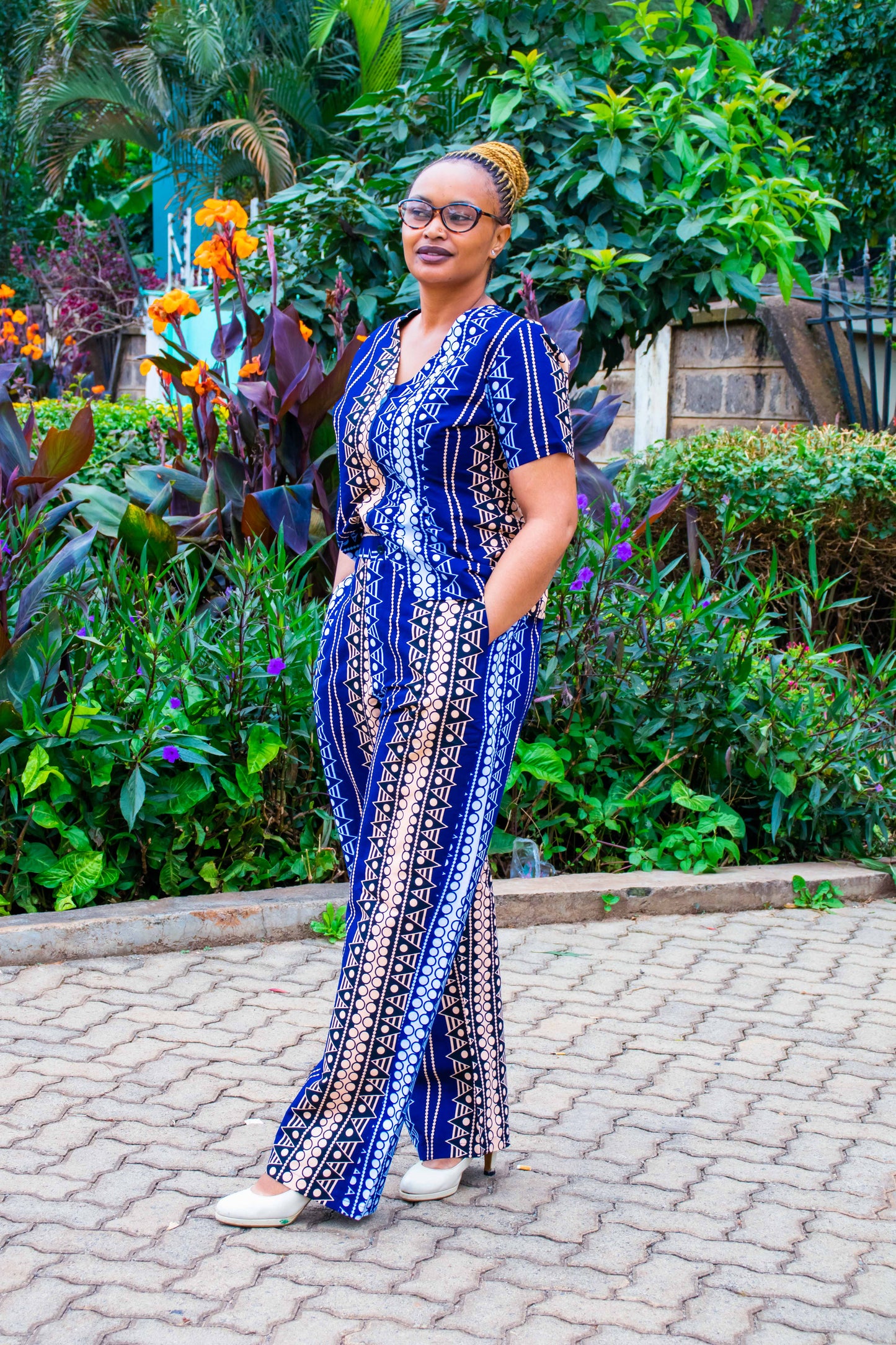 Two Piece navy blue wth white, peach dots and lines motif