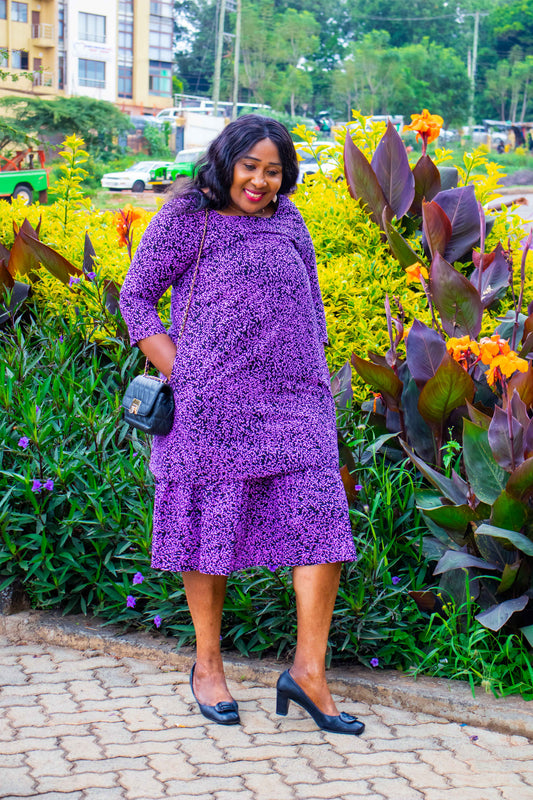 A-Line dress with bottom ruffles. Black ground  and lilac floral motif