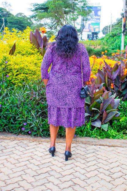 A-Line dress with bottom ruffles. Black ground  and lilac floral motif