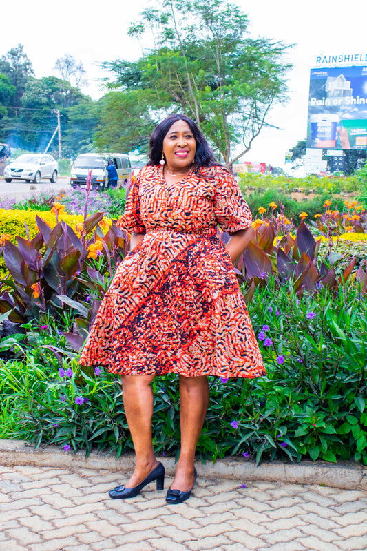 A-Line dress with cream, black, brown and red prints motif