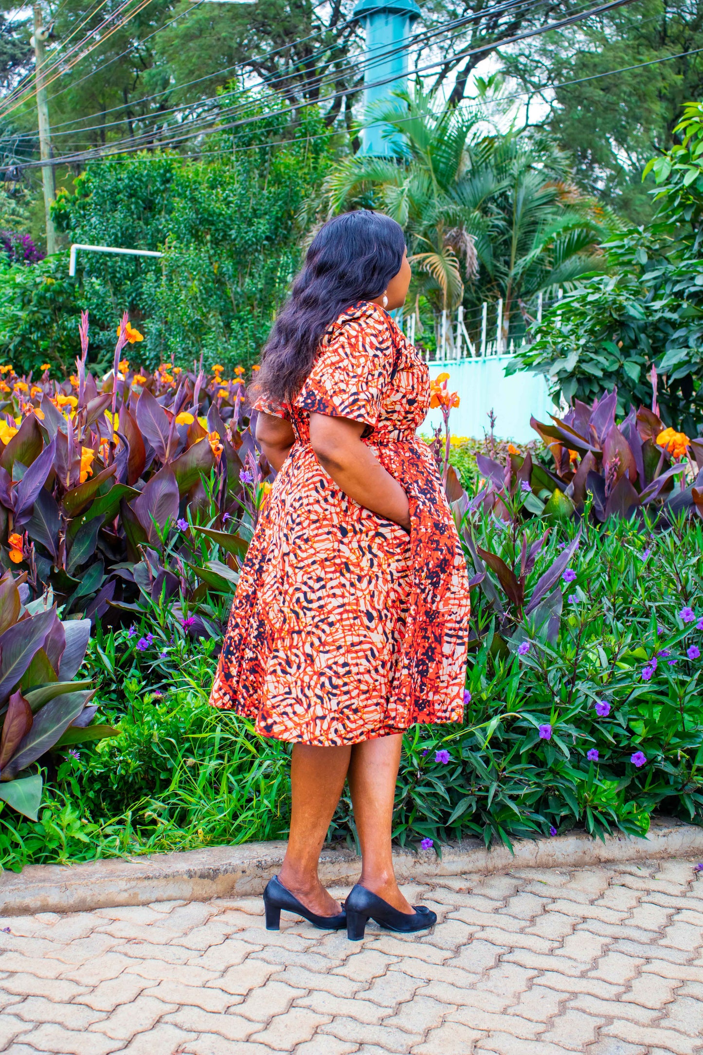 A-Line dress with cream, black, brown and red prints motif