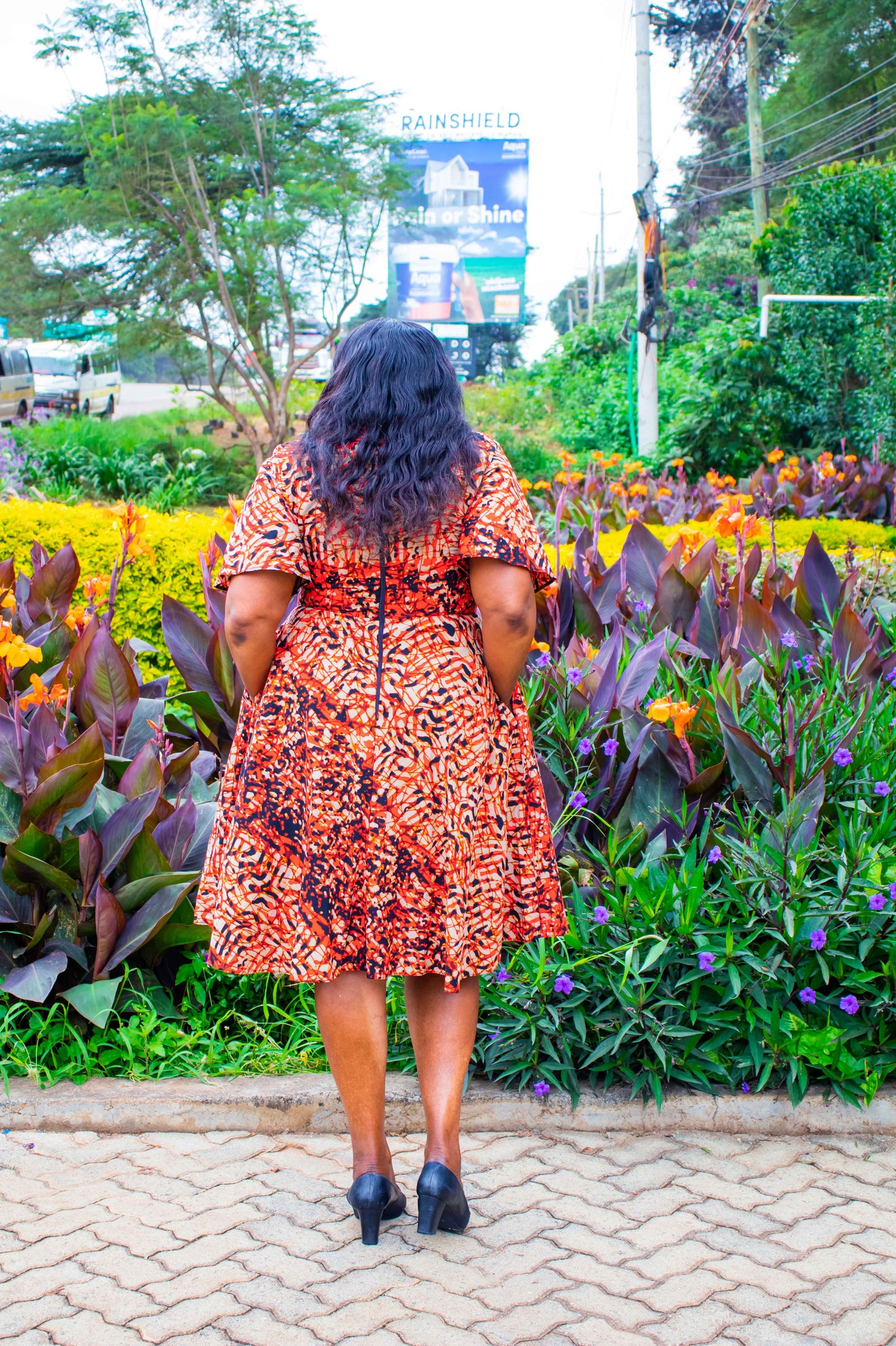 A-Line dress with cream, black, brown and red prints motif
