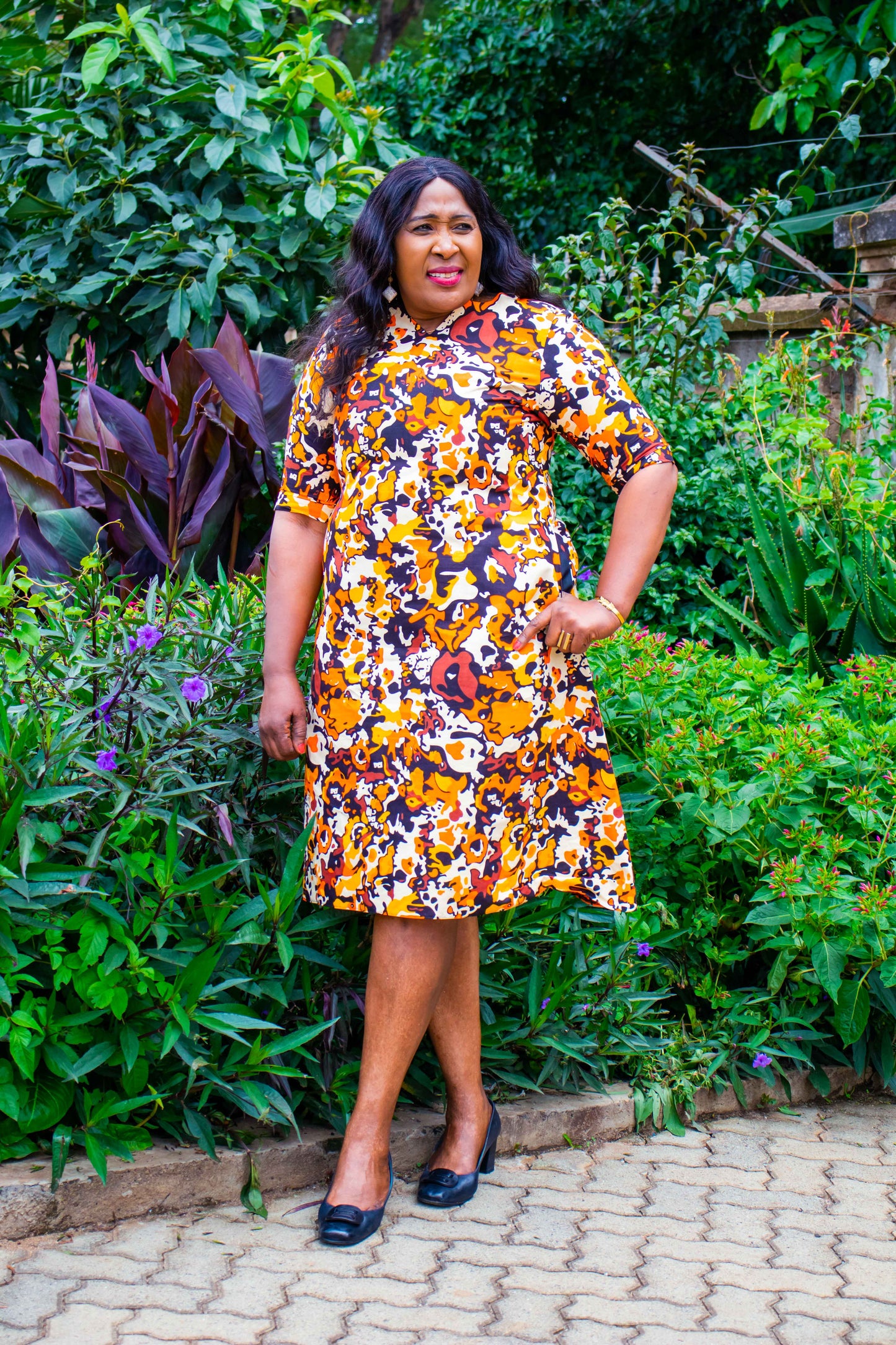 A-Line dress with orange, cream, yellow and brown floral motif