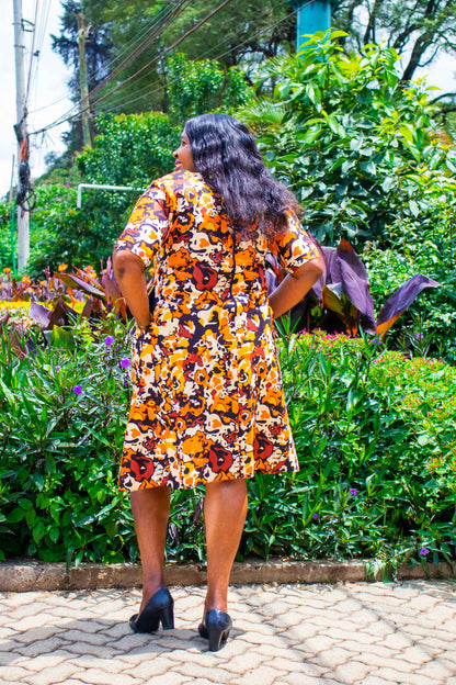 A-Line dress with orange, cream, yellow and brown floral motif
