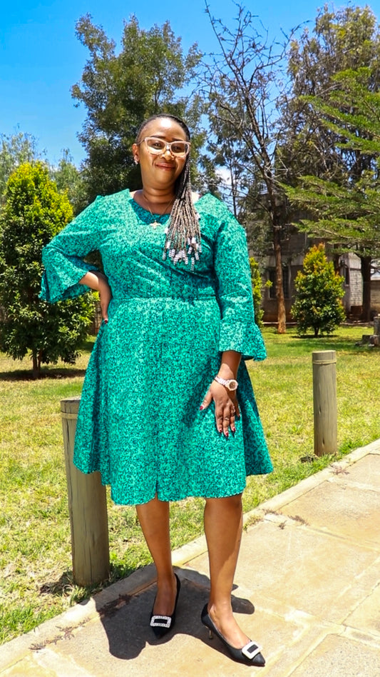 A-Line - turqouise green  and black floral motif. Long flared sleeves.