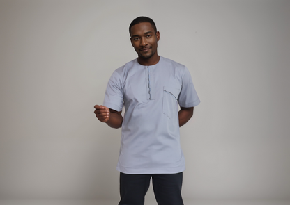 Short sleeve shirt - Light Grey color polyester/cotton.  Embroidery on right shoulder, yoke and pocket flat.