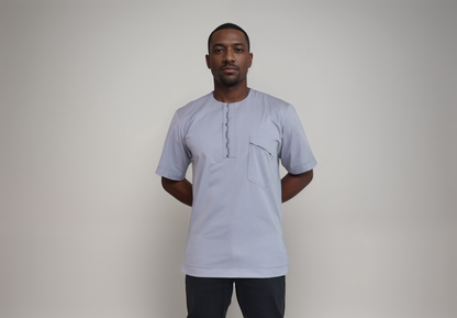 Short sleeve shirt - Light Grey color polyester/cotton.  Embroidery on right shoulder, yoke and pocket flat.