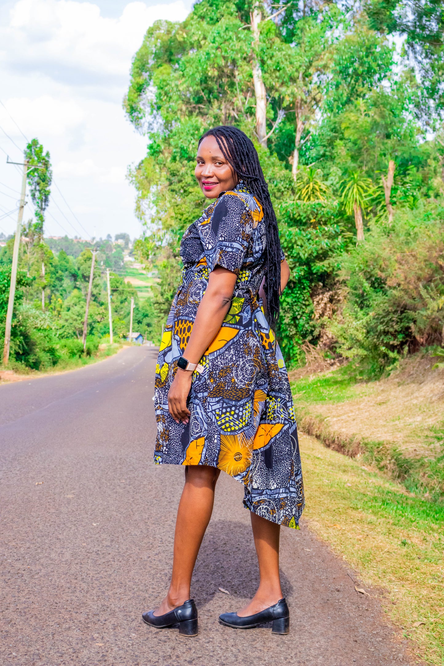 Mullet dress of black, grey, orange, white and yellow motif