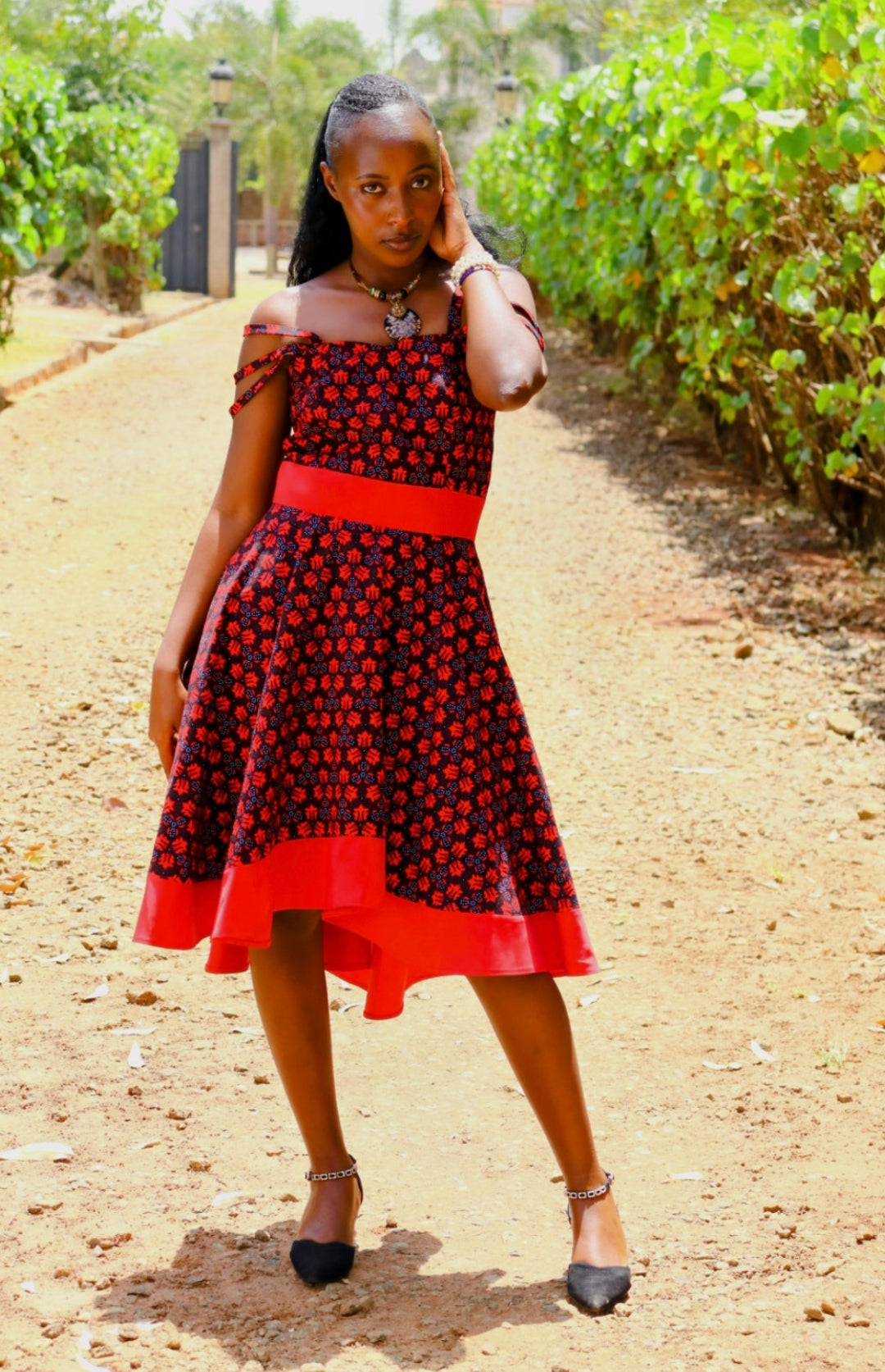 Rufflette dress- Back and red  and white  dot floral motif. Plain red contrast